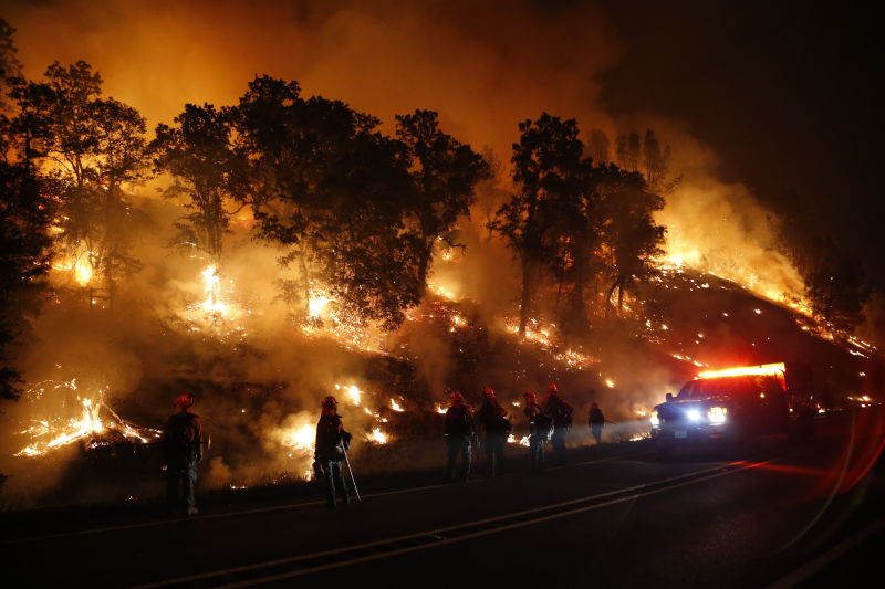 Firefighters with the Marin County Fire Department's Tamalpais Fire Crew monitor a backfire as they battle the Valley Fire. (Stephen Lam/ Getty Images)