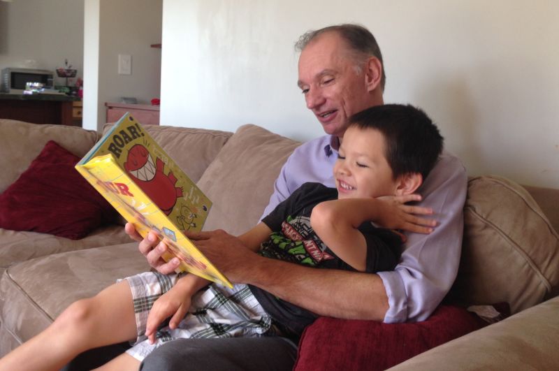 Bill Magoolaghan reads to his 4-year-old son, Cole, at their rebuilt home in San Bruno.