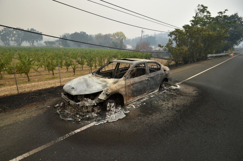 Melted metal flows from a burned out car abandoned on a highway during the Valley fire in Middletown, California. (Josh Edelson/AFP/Getty Images)
