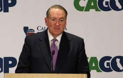Former Arkansas Gov. Mike Huckabee speaks to reporters on Sept. 18 at the California Republican Party convention.