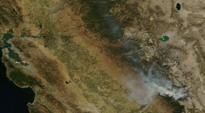 NASA satellite view showing smoke from the Rough Fire spreading north and west over the Sierra Nevada and San Joaquin Valley. (Click for larger image.)