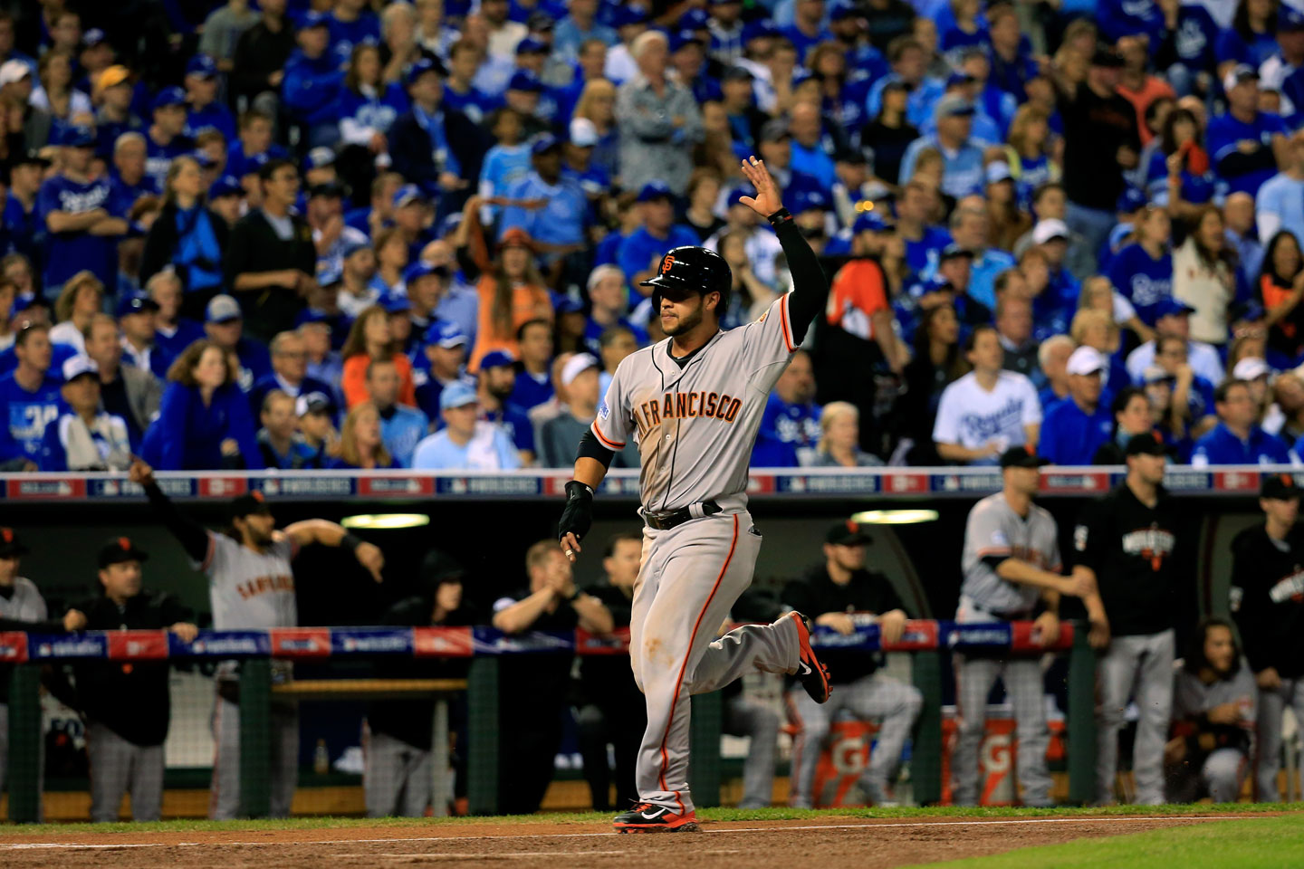 Gregor Blanco, who had singled to lead off the game, trots across the plate on a Pablo Sandoval double in the top of the first. Giants 1, Royals 0.  (Rob Carr/Getty Images)