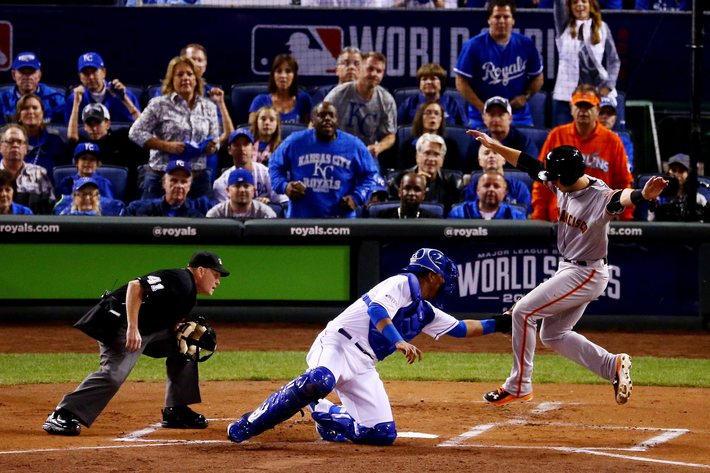 Buster Posey also tried to score on Sandoval's double in the top of the first, but was out by a mile. (Elsa/Getty Images)