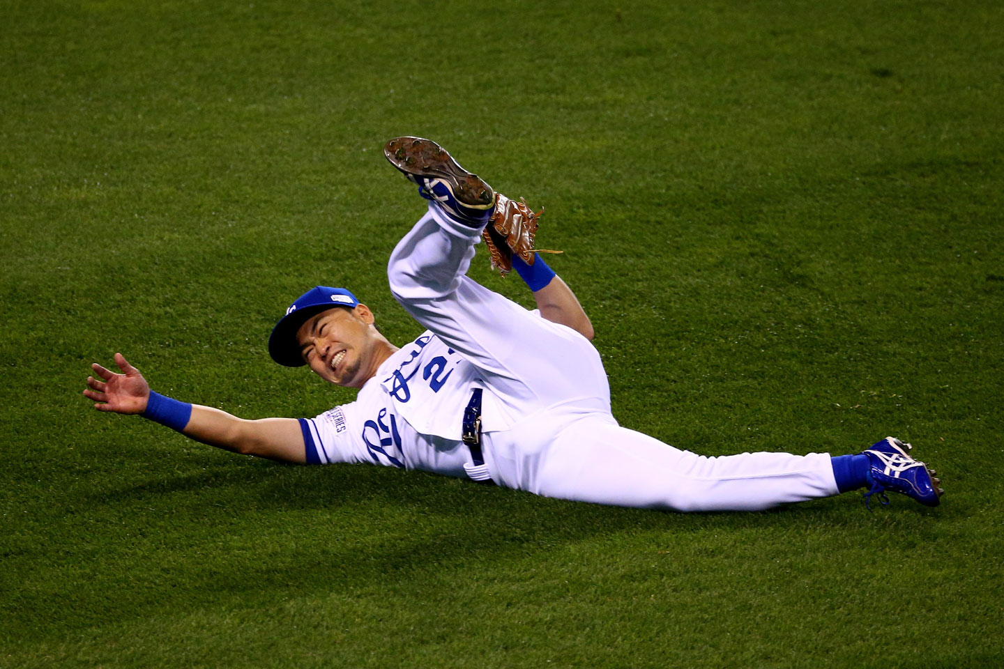 Royals right fielder Nori Aoki sprawls helplessly after misplaying a blistering one-hop drive in the gap by the Giants' Joe Panik. Gregor Blanco scored on the play. Panik wound up on third with a triple and later scored on Pablo Sandoval's single. Giants 7, Royals 0. (Elsa/Getty Images)