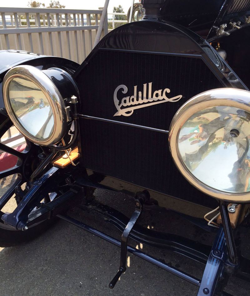 Hand-cranks like the one pictured were used to start cars like this 103-year-old Cadillac.