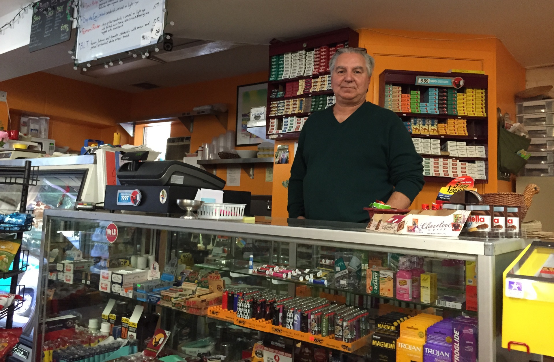 Dean Nicolaides stands at the counter of Dino's Loch Lomond Market on Sept. 29, 2015. The store had yet to reopen following the Valley Fire that destroyed Nicolaides' home along with about 1,300 others.