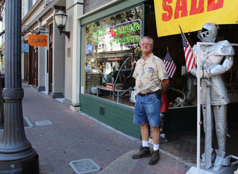 Ralph Garcia stands in front of his Ralph's Vacuum & Sewing Center on Main Street, which opened in 1978.