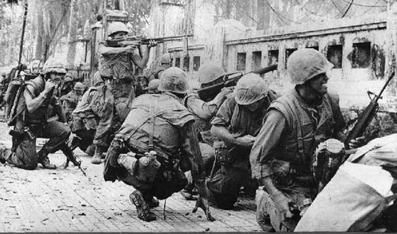 U.S. Marines taking sniper fire in Hue during the Tet Offensive.