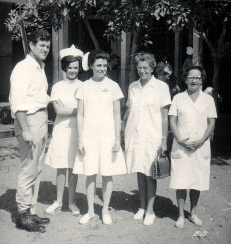 Ted Kennedy stands next to Maureen Orr and Carol Portner (L-R) during a visit Kennedy made to their hospital in Nha Trang, Vietnam.
