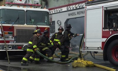 San Francisco firefighters battle a three-alarm fire at a tire shop in the city's Mission District on Nov. 8.