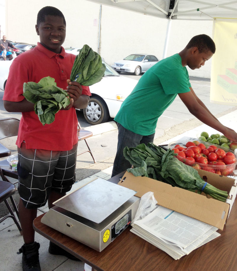 Twin brothers Dayvon and Dashon Standifer sell produce they grew themselves.