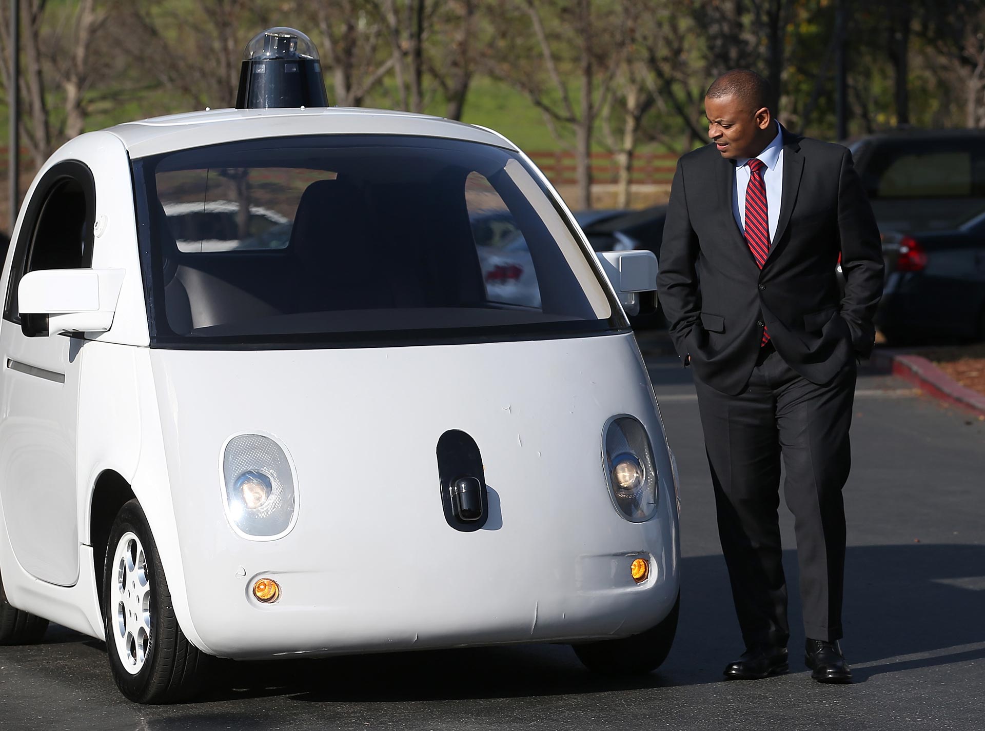 U.S. Transportation Secretary Anthony Foxx inspects a Google self-driving car at the Google headquarters on February 2, 2015.