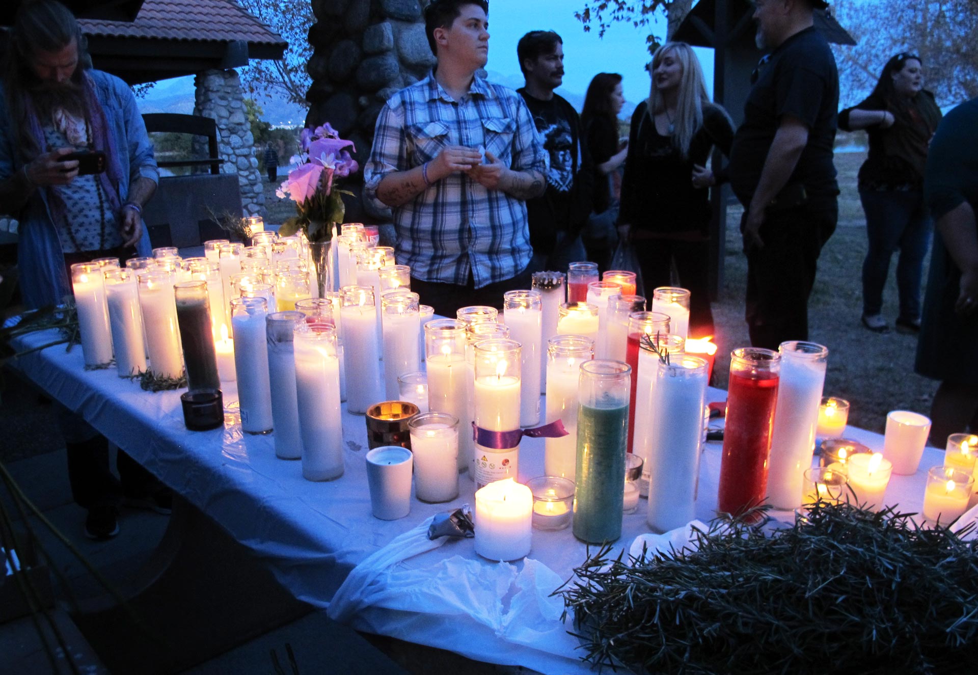 About 100 people gathered at the site of the Renaissance Pleasure Faire in Irwindale on Saturday for a candlelight vigil to remember San Bernardino shooting victim Larry Daniel Kaufman. 