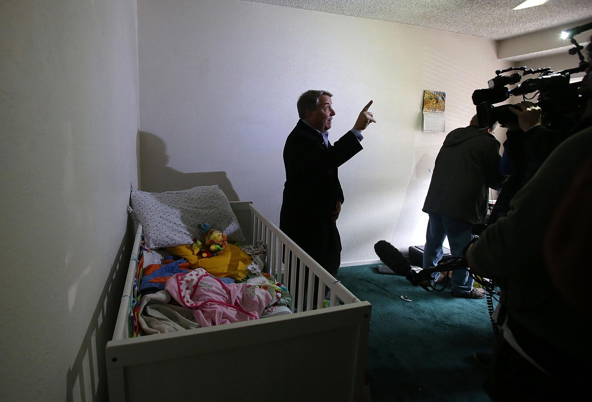 A reporter does a live shot inside the home of shooting suspect Syed Farook on Dec. 4, 2015 in San Bernardino.