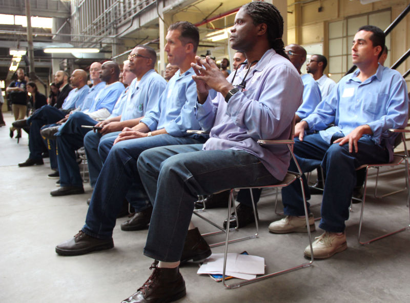 Code 7370's student inmates listen to introductory speeches on Demo Day prior to their projects' presentation at San Quentin.