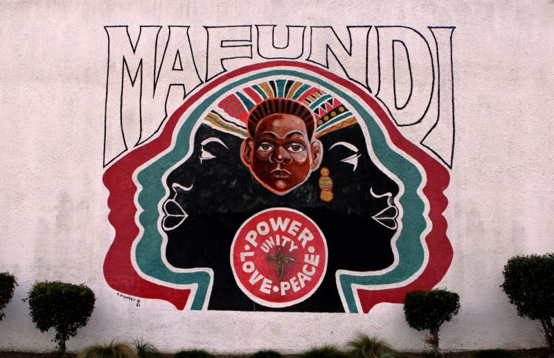 The Mafundi Institute mural on 103rd street in Watts. The historic building, long a hub of local arts and activism, is now home to the Mafundi auditorium and the Watts Coffee House and restaurant