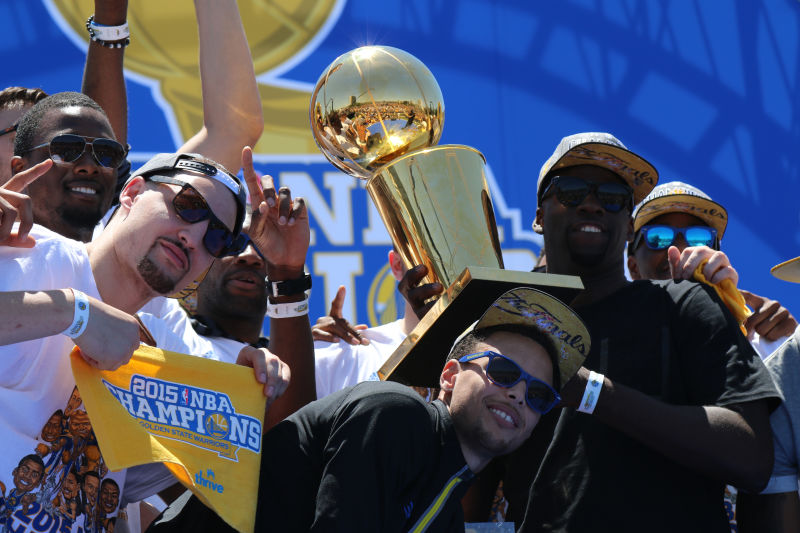 Green and teammates celebrate at the championship parade in Oakland last June. (Adam Grossberg/KQED)