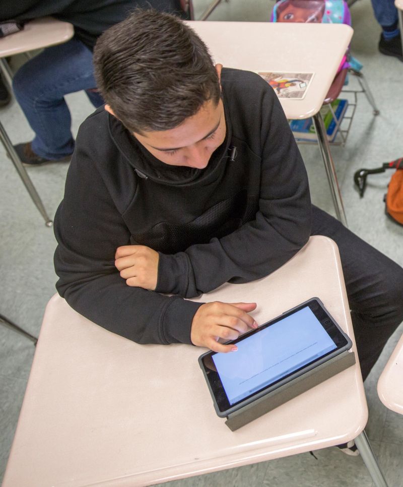 Kevin Navarro, a senior at Vallejo High School, uses an iPad in class.