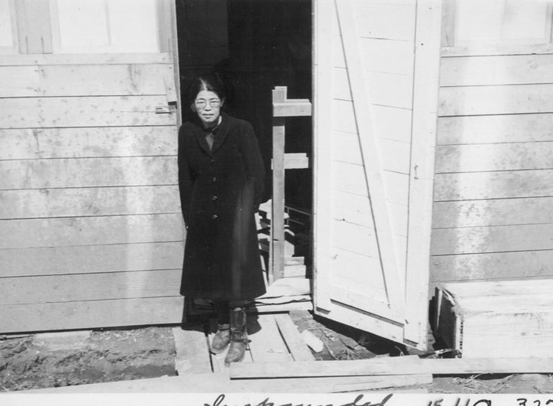 A Japanese woman in the door of her living quarters in San Bruno.