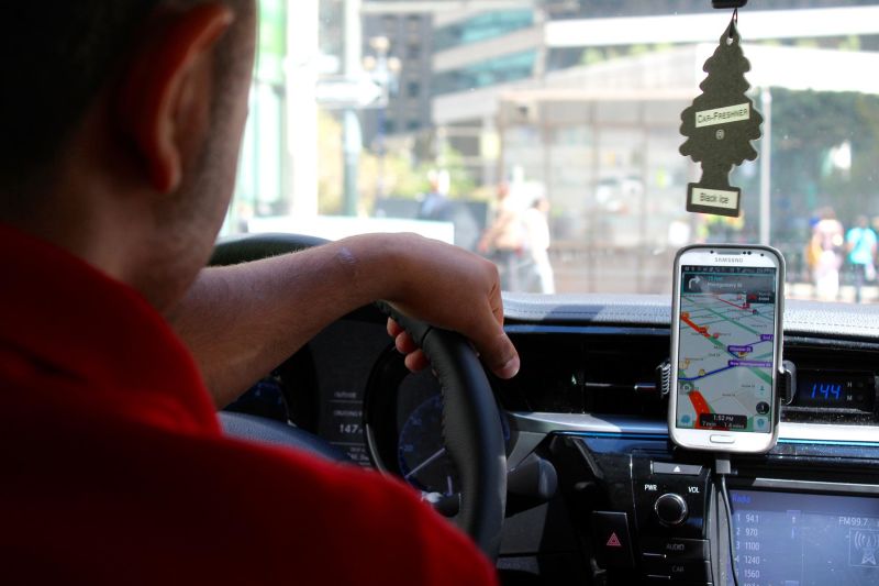 Adnan Aloudi, a full-time Uber and Lyft driver, drives through downtown San Francisco.