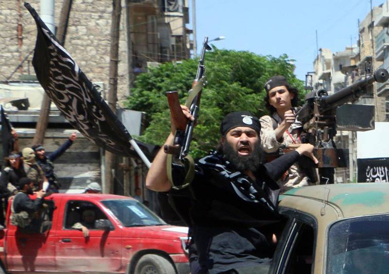 Fighters with the al-Nusra Front drive in the Syrian city of Aleppo, flying Islamist flags in 2015. For gay refugees like Nahas, they were even worse than the Assad regime.