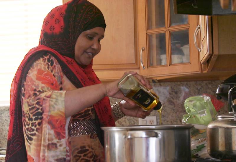 Mariam Ali cooks pasta in her home in Diego’s Teralta neighborhood.