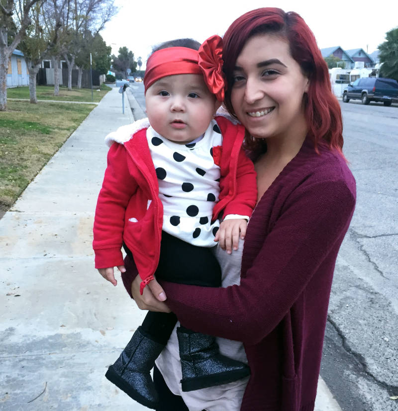 Cassandra Baca, 22, and her baby daughter, Amoriee. Baca says she's too busy as a working single mom to think about voting.