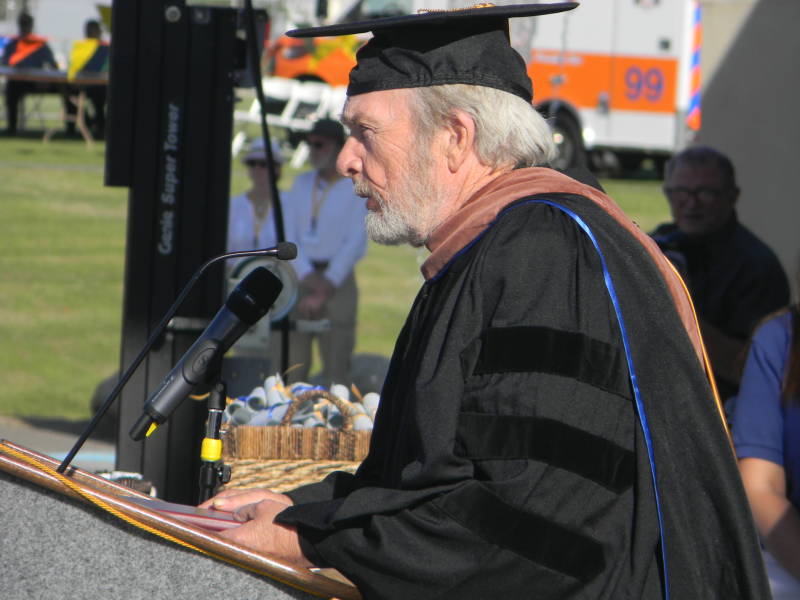 Merle Haggard accepts his honorary doctorate at Cal State Bakersfield in 2013. His childhood friend, author Gerald Haslam, watched him accept the honor of becoming "Dr. Haggard." 