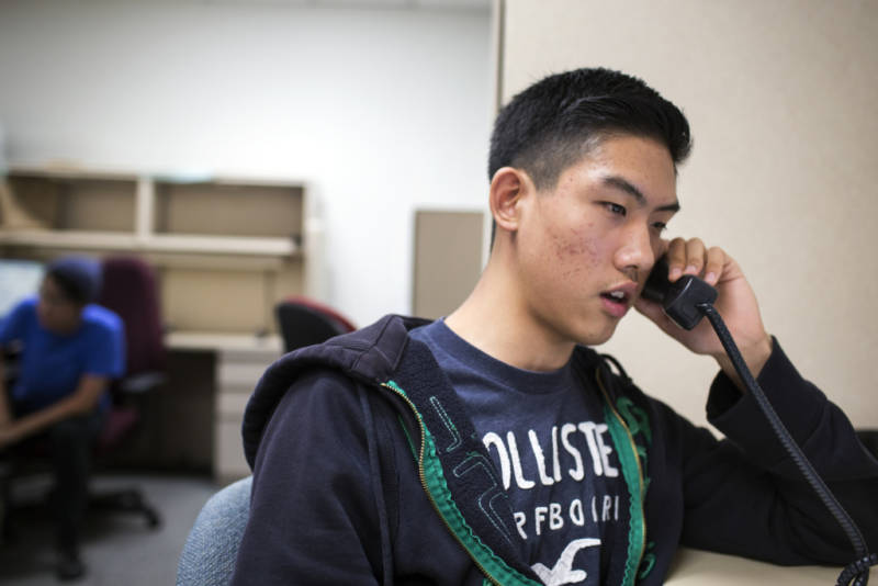 Andrew Hur, a junior at the Los Angeles Center for Enriched Studies, makes a call in Korean during a phone bank shift reminding people to vote in the upcoming primary election at Asian Americans Advancing Justice Los Angeles on May 23, 2016. Phone calls in Korean are focused on L.A.'s Koreatown and Cerritos.