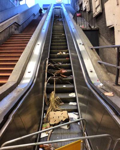Refuse accumulated on broken escalator at BART's 16th Street Station, March 2016.