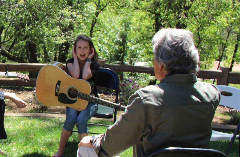 Daisy Kerr performs vocal exercises during a workshop with musician Keith Little at her home in Placerville.