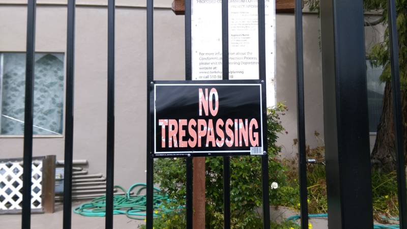 Fences and "No Trespassing" signs appear throughout Smith's street today. 