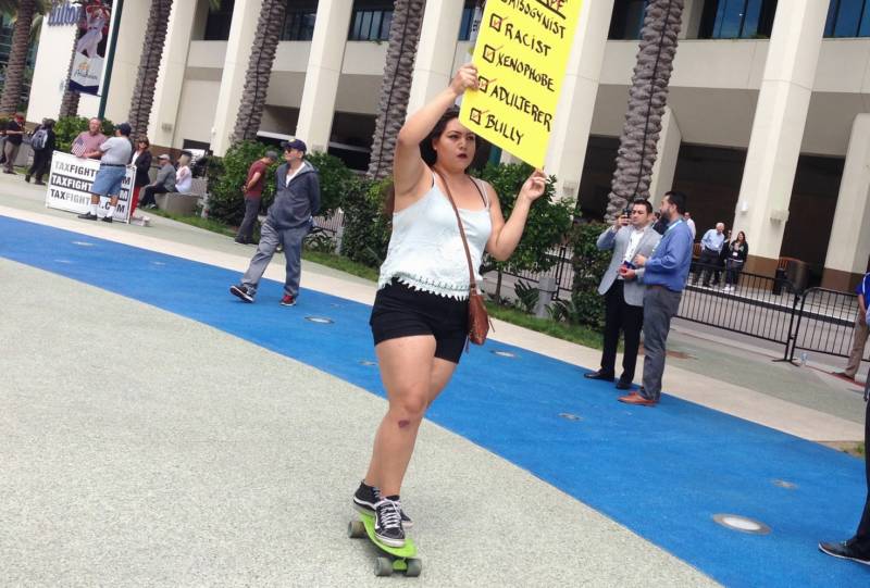 Lisbeth Bariera of Anaheim delivered her anti-Trump message via skateboard on Wednesday.