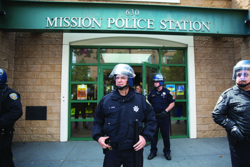 SFPD Officer Craig Tiffe at a protest outside Mission Station on Aug. 23, 2015.