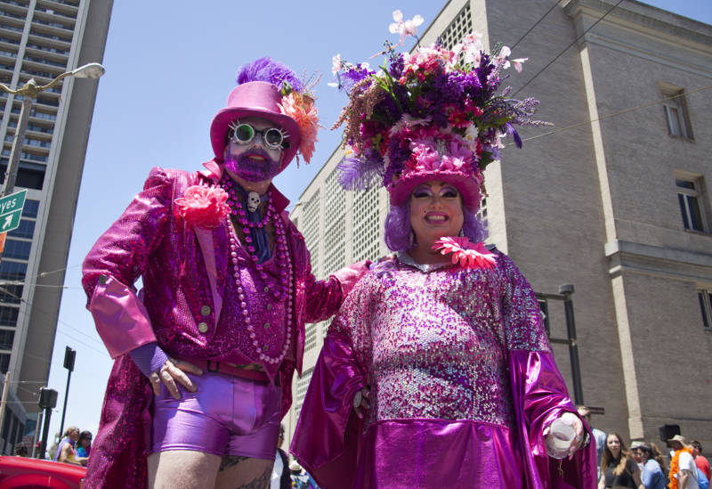 Two people from Sonoma County Pride march in San Francisco's Pride Parade.