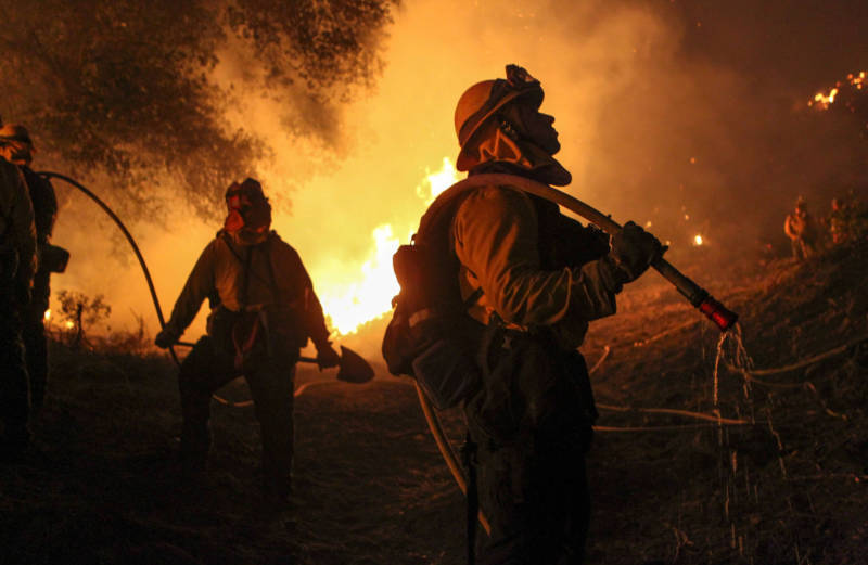 Firemen work to contain the Border Fire in eastern San Diego County on June 21, 2016.