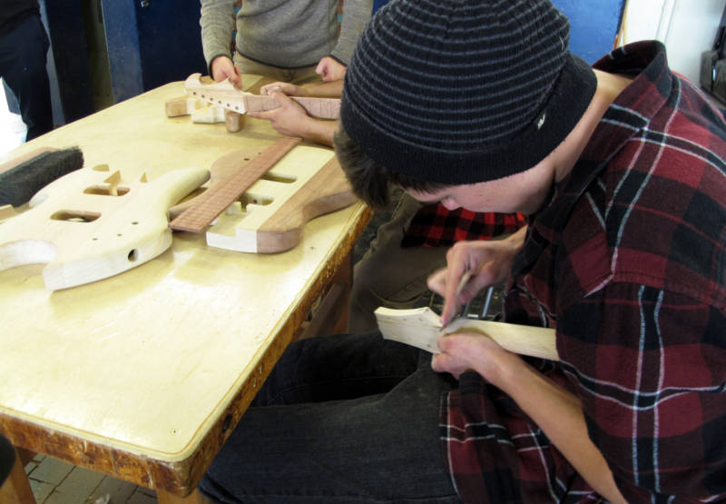 Student Cameron Shirley says sanding has been the biggest challenge of making his guitar in the STEM Guitar Project at Camarillo High School.