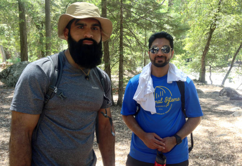 Tariq Malik (L) enjoys the splendors of Yosemite with Hamid Malik. When Tariq travels for work, he often wears a sign in airports reading, 'I’m a Muslim, ask me anything!'