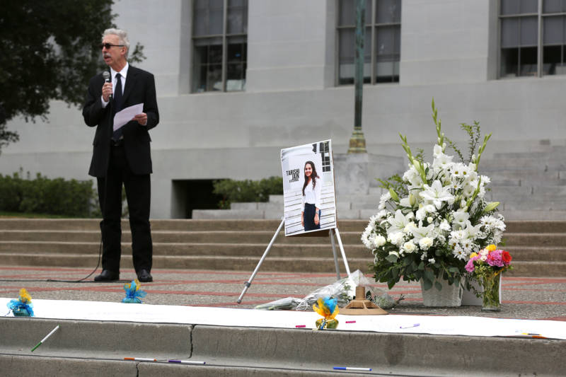 UC Berkeley Chancellor Nicholas Dirks stands behind a memorial for Tarishi Jain during a vigil for the 19-year-old UC Berkeley student which was held on UC Berkeley's campus in Berkeley, Calif. on July 5, 2016. Jain was one of the victims of an attack at a Dhaka cafe in Bangladesh on July 2,2016.