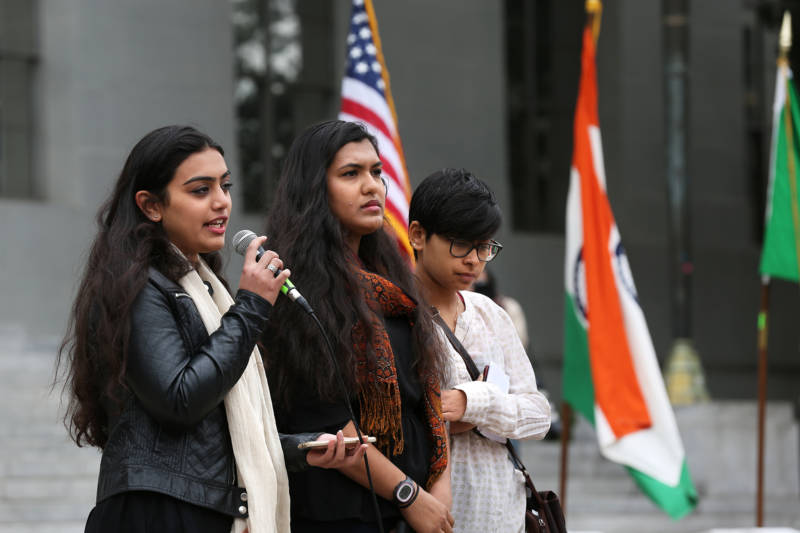 Three students from the South Asian, Southwest Asian and North African Student Coalition spoke during a vigil for 19-year-old UC Berkeley student Tarishi Jain, one of the victims of an attack at a Dhaka cafe in Bangladesh on July 2,2016. The vigil was held on UC Berkeley's campus in Berkeley, Calif. on July 5, 2016.