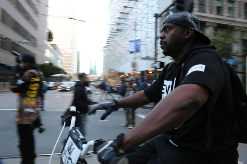 Jason Juniel rides at the front of the march from Embarcadero to City Hall Friday evening in San Francisco. 