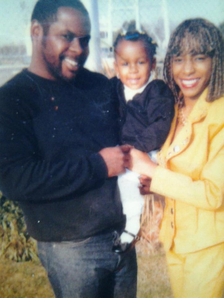 Tiera McGill with her parents in East Oakland. 