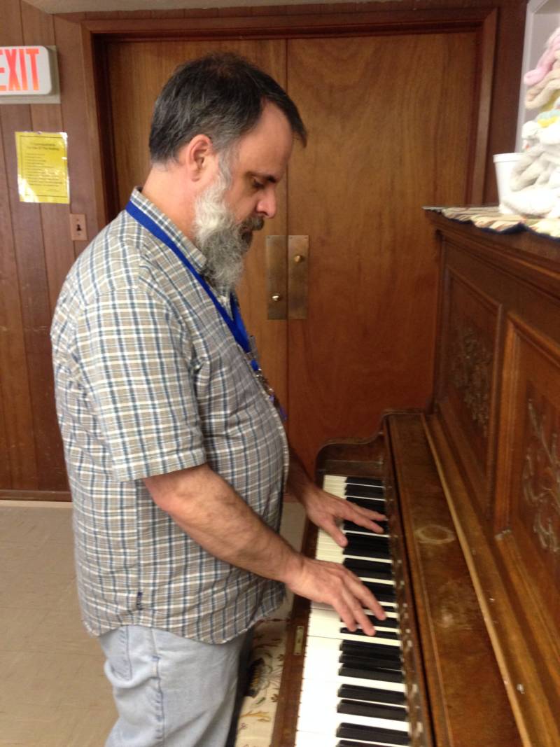 Blair Chenoweth plays the piano at Mariposa United Methodist Church where he now volunteers. 