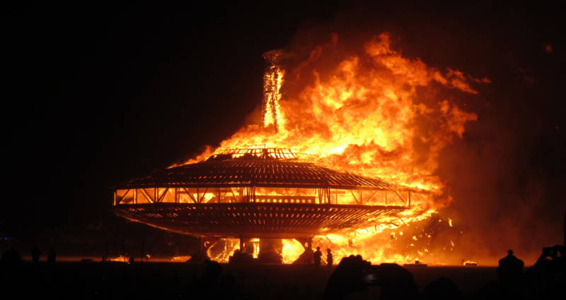 The UFO at Burning Man 2013 goes up in flames.