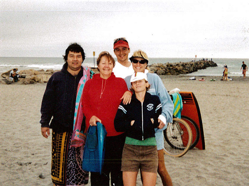 Jason Nishimoto (left) on the beach with family and friends.