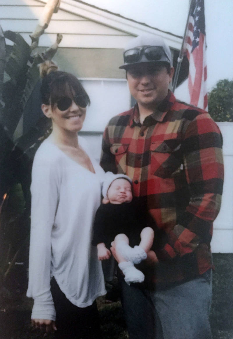 Rachel and Anthony Powers with their baby Elvis. Anthony missed his first Father's Day because of a firefighting shift. 