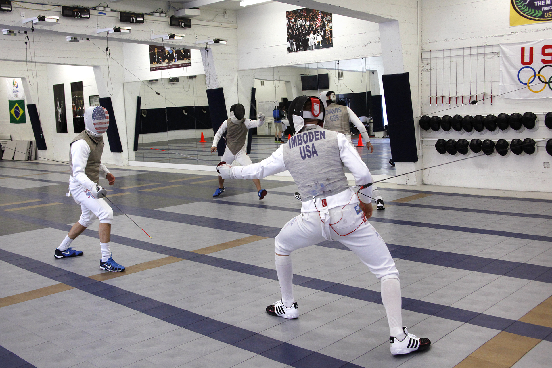 U.S. National fencing team athletes Gerek Meinhardt (left) and Race Imboden (right) practice their fencing techniques. Both will be heading to Rio to compete in the 2016 Olympics.