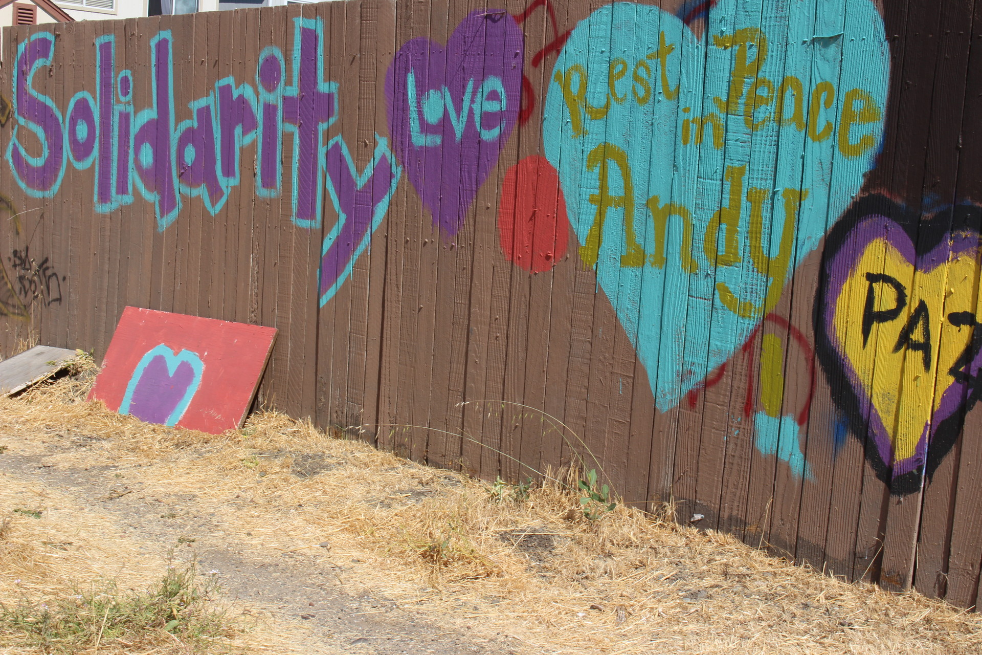 Paintings decorate a fence just feet away from where Andy Lopez died in 2013. Residents lobbied the county to build a park in the now empty lot. Construction of Andy's Unity Park is set to begin in the fall, with design input from residents.