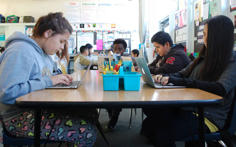 A class of sixth grade students tackle a computer assignment at Oak Ridge Elementary in Sacramento.