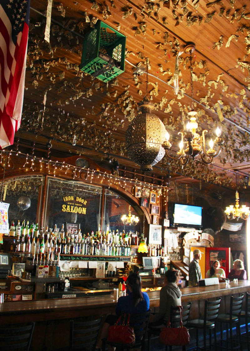 The Iron Door Saloon's ceiling, covered in dollar bills.